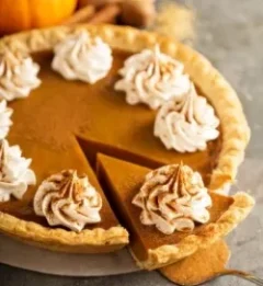 Tasty classic pumpkin pie with spiced whipped cream for the best dishes for your thanksgiving dinner this year in Aspen city